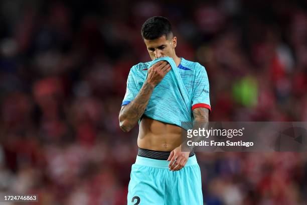 Joao Cancelo of FC Barcelona reacts after the draw against Granada CF during the LaLiga EA Sports match between Granada CF and FC Barcelona at...