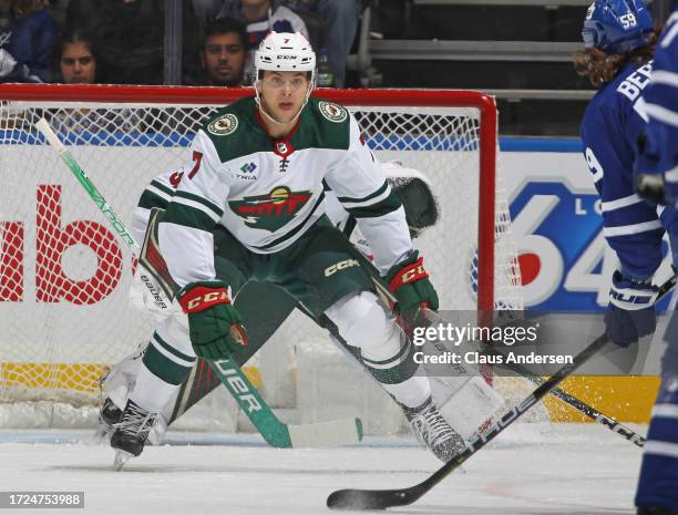 Brock Faber of the Minnesota Wild defends against the Toronto Maple Leafs during the first period in an NHL game at Scotiabank Arena on October 14,...