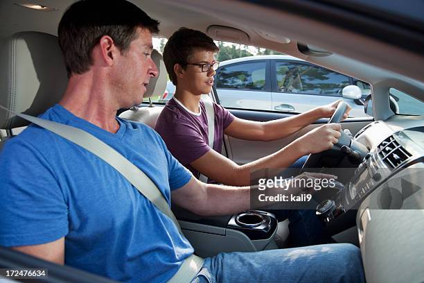 teenager learning to drive - driving instructor stock pictures, royalty-free photos & images