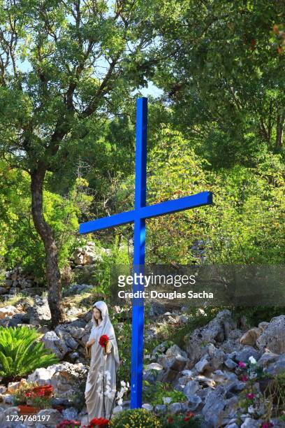 our lady of medjugorje and blue cross of christ - cold war stock pictures, royalty-free photos & images