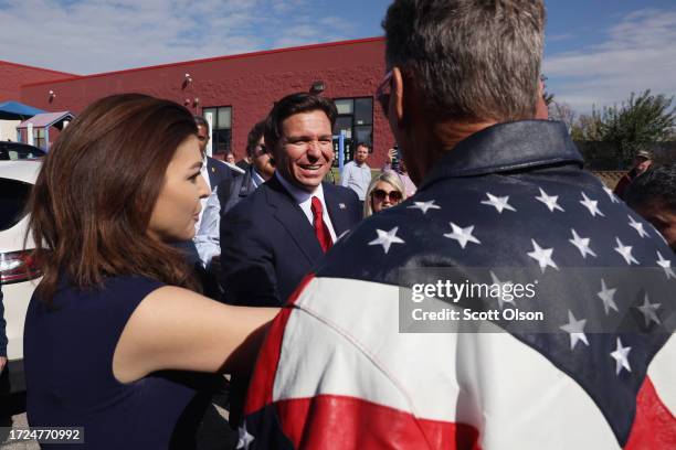 Republican presidential candidate Florida Governor Ron DeSantis and his wife Casey DeSantis speak with guests following a campaign event at Refuge...