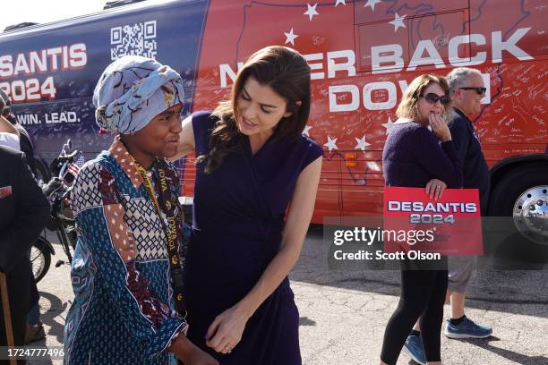 Casey DeSantis, the wife of Republican presidential candidate Florida Governor Ron DeSantis, chats with 15-year-old Congolese immigrant Shukurani...