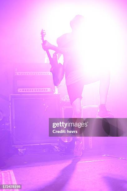 high jumping guitar on a stage - emo guy stock pictures, royalty-free photos & images