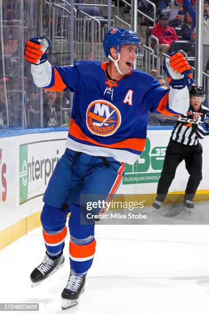 Brock Nelson of the New York Islanders celebrates after scoring his second first period goal against the Buffalo Sabres at UBS Arena on October 14,...
