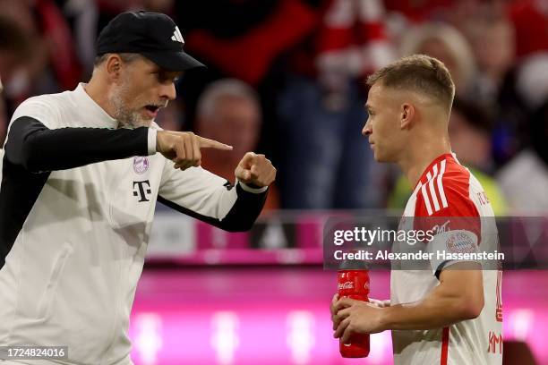 Thomas Tuchel, head coach of FC Bayern München talks to his player Joshua Kimmich during the Bundesliga match between FC Bayern München and...