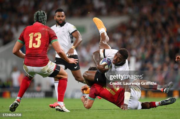 Josua Tuisova of Fiji is tackled by Jose Lima of Portugal during the Rugby World Cup France 2023 match between Fiji and Portugal at Stadium de...