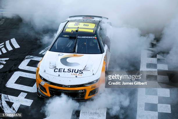Allmendinger, driver of the Celsius Chevrolet, celebrates after winning the NASCAR Cup Series Bank of America ROVAL 400 at Charlotte Motor Speedway...
