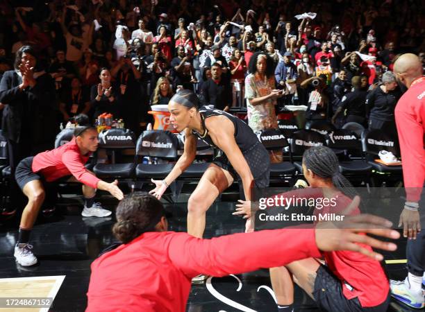 Ja Wilson of the Las Vegas Aces is greeted by teammates during player introductions before Game One of the 2023 WNBA Playoffs finals against the New...