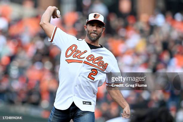 Hardy, a Baltimore Orioles Hall of Fame player, throws the ceremonial first pitch during Game Two of the Division Series between the Baltimore...