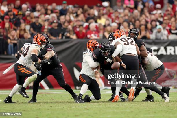 Joshua Dobbs of the Arizona Cardinals fumbles the football against the Cincinnati Bengals during the fourth quarter at State Farm Stadium on October...