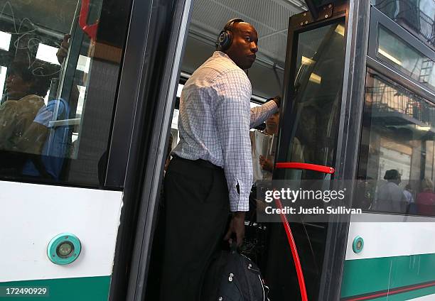 Commuter stands inside an Alameda-Contra Costa Transit bus on July 2, 2013 in Oakland, California. For a second day, hundreds of thousands of San...