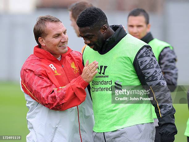 Brendan Rodgers manager of Liverpool talks with Kolo Toure new signing for Liverpool during a training session at Melwood Training Ground on July 2,...