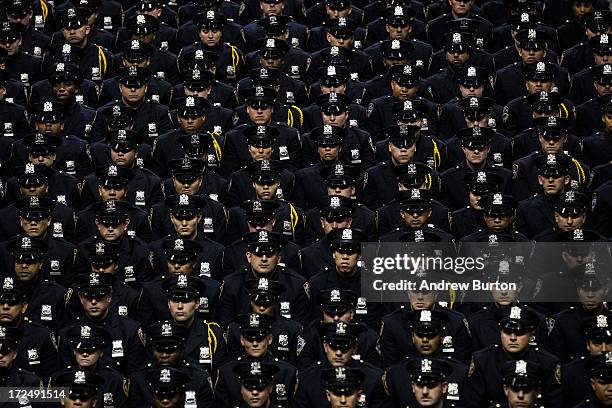 New York City Police Academy cadets attend their graduation ceremony at the Barclays Center on July 2, 2013 in the Brooklyn borough of New York City....