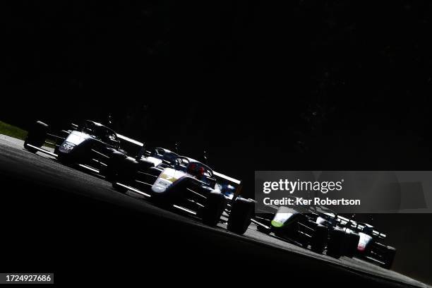 The ROKiT F4 field drives through Sheene Curve during the British Touring Car Championship at Brands Hatch on October 08, 2023 in Longfield, England.