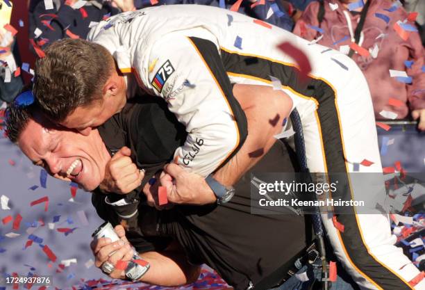 Allmendinger, driver of the Celsius Chevrolet, and Matt Kaulig, owner of Kaulig Racing celebrate in victory lane after winning the NASCAR Cup Series...