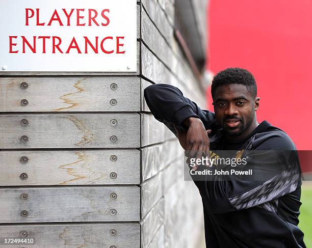 Kolo Toure of Liverpool signs a contract for Liverpool Football Club at Melwood Training Ground on July 2, 2013 in Liverpool, England.