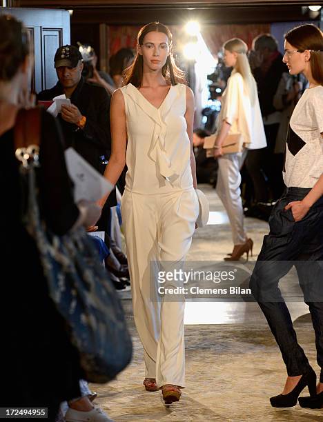 Models walk the runway at the Green Showroom during Mercedes-Benz Fashion Week Spring/Summer 2014 at Brandenburg Gate on July 2, 2013 in Berlin,...