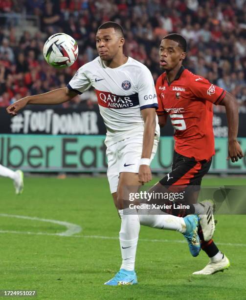 Kylian Mbappe of Paris Saint-Germain in action with Warmed Omari of Rennes during the Ligue 1 Uber Eats match between Stade Rennais FC and Paris...