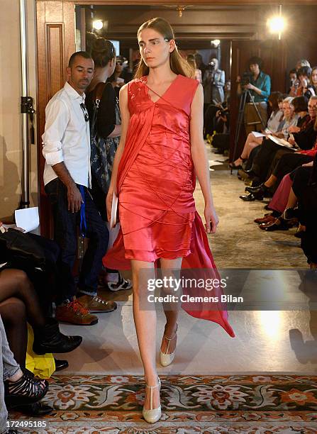 Model walks the runway at the Green Showroom during Mercedes-Benz Fashion Week Spring/Summer 2014 at Brandenburg Gate on July 2, 2013 in Berlin,...