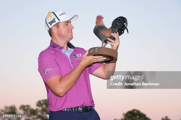 Luke List of the United States celebrates with the trophy after winning the Sanderson Farms Championship at The Country Club of Jackson on October...