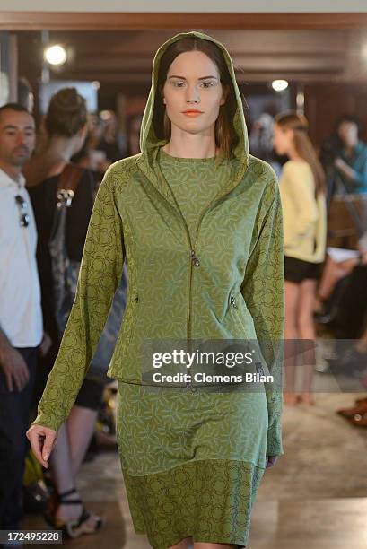 Model walks the runway at the Green Showroom during Mercedes-Benz Fashion Week Spring/Summer 2014 at Brandenburg Gate on July 2, 2013 in Berlin,...