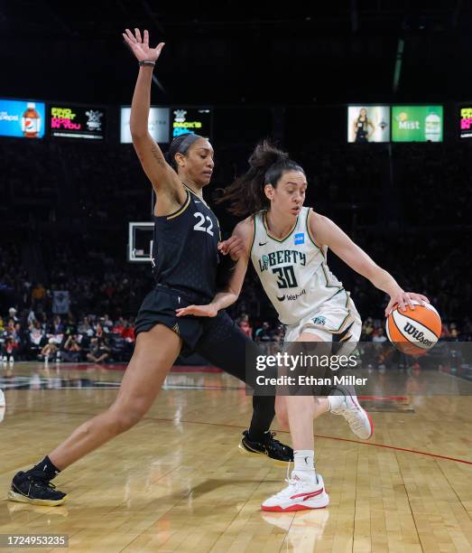 Ja Wilson of the Las Vegas Aces guards Breanna Stewart of the New York Liberty in the third quarter of Game One of the 2023 WNBA Playoffs finals at...