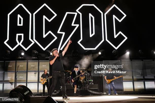 Stevie Young, Brian Johnson, Angus Young, and Cliff Williams of AC/DC perform onstage during the Power Trip music festival at Empire Polo Club on...