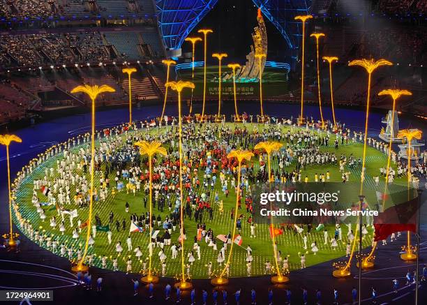 Athletes attend the closing ceremony of the 19th Asian Games at the Hangzhou Olympic Sports Centre Stadium on October 8, 2023 in Hangzhou, Zhejiang...