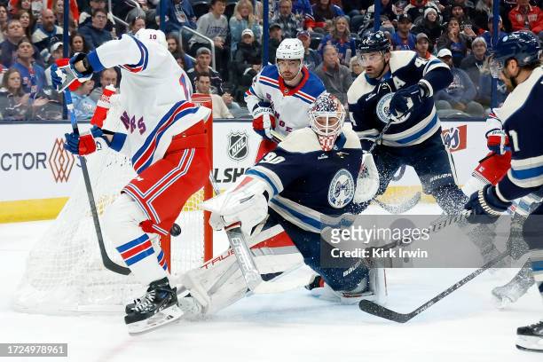 Elvis Merzlikins of the Columbus Blue Jackets stops a shot by Artemi Panarin of the New York Rangers during the first period of the game at...