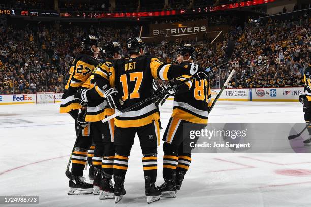 Jake Guentzel of the Pittsburgh Penguins celebrates his third period goal against the Calgary Flames at PPG PAINTS Arena on October 14, 2023 in...