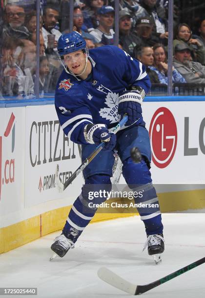 John Klingberg of the toronto Maple Leafs clears a puck against the Minnesota Wild during the third period in an NHL game at Scotiabank Arena on...