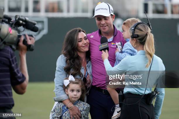 Luke List of the United States is interviewed alongside wife Chloe, daughter Ryann and son Harrison after winning the Sanderson Farms Championship at...