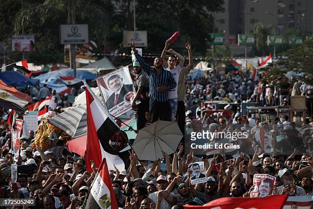 Supporters of Egyptian President Mohammed Morsi demonstrate at the Rabaa al Adawiya Mosque in the suburb of Nasr City on July 2, 2013 in Cairo,...