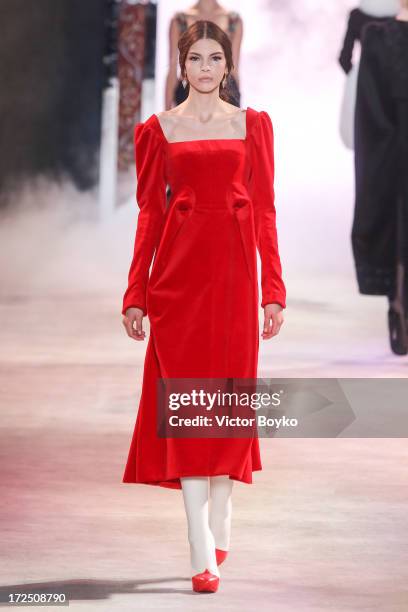 Model walks the runway during the Ulyana Sergeenko show as part of Paris Fashion Week Haute-Couture Fall/Winter 2013-2014 at on July 2, 2013 in...