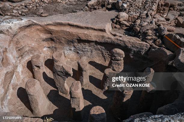 Photograph taken at the archaeological site of Karahantepe in Sanliurfa, southeastern Turkey on October 9 shows resurfaced artifacts. On this...