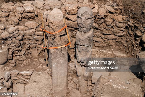 Photograph taken at the archaeological site of Karahantepe in Sanliurfa, southeastern Turkey on October 9 shows a newly found 2.3-meter high human...
