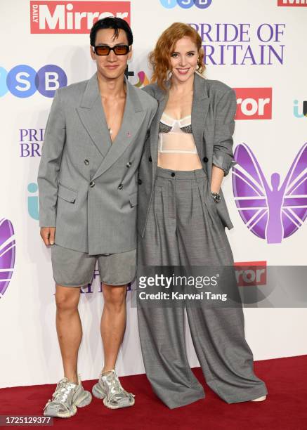 Carlos Gu and Angela Scanlon arrive at the Pride Of Britain Awards 2023 at Grosvenor House on October 08, 2023 in London, England.