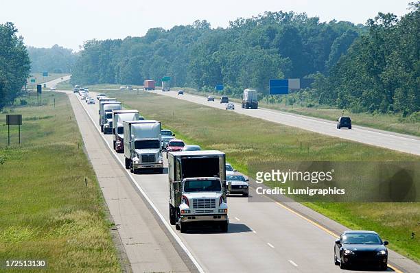 view of the highway traffic with trucks lined up - michigan stock pictures, royalty-free photos & images
