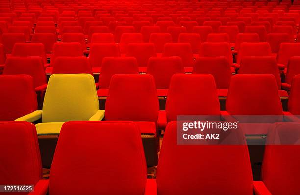 red seats and one different - reserved sign stock pictures, royalty-free photos & images