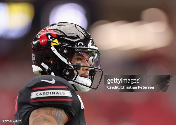 Running back James Conner of the Arizona Cardinals warms up before the NFL game at State Farm Stadium on October 08, 2023 in Glendale, Arizona. The...