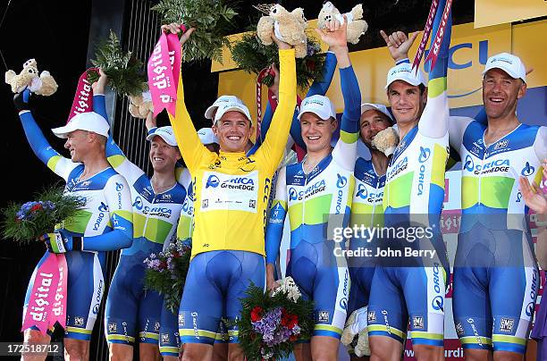 Simon Gerrans of Australia and Team Orica-GreenEdge takes the yellow jersey after winning with his teammates Stage Four of the Tour de France 2013 -...