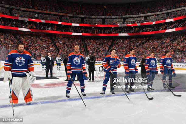 Stuart Skinner, Darnell Nurse, Ryan Nugent-Hopkins, Cody Ceci, Zach Hyman and Leon Draisaitl of the Edmonton Oilers stand for the singing of the...