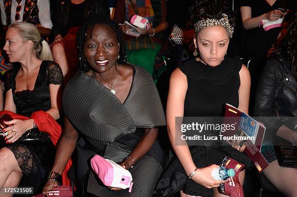 Auma Obama and daughter Akini attend the Arrey Kono, Nadir Tati, Romero Bryan Show during Mercedes-Benz Fashion Week Spring/Summer 2014 at...