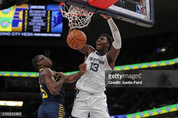 Jaren Jackson Jr. #13 of the Memphis Grizzlies dunks during the second half against Jalen Smith of the Indiana Pacers at FedExForum on October 08,...