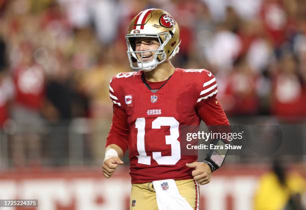 Brock Purdy of the San Francisco 49ers reacts after a touchdown by Jordan Mason during the fourth quarter against the Dallas Cowboys at Levi's...