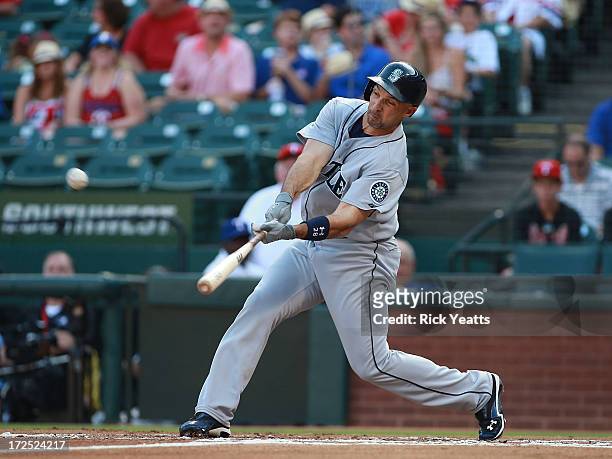 Raul Ibanez of the Seattle Mariners hits a home run in the first inning against the Texas Rangers at Rangers Ballpark in Arlington on July 2, 2013 in...