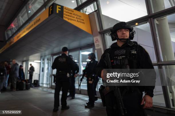 Heavily armed Port Authority police stand guard outside of JFK Terminal 4 before a flight leaves to Tel Aviv on October 14, 2023 in New York City....