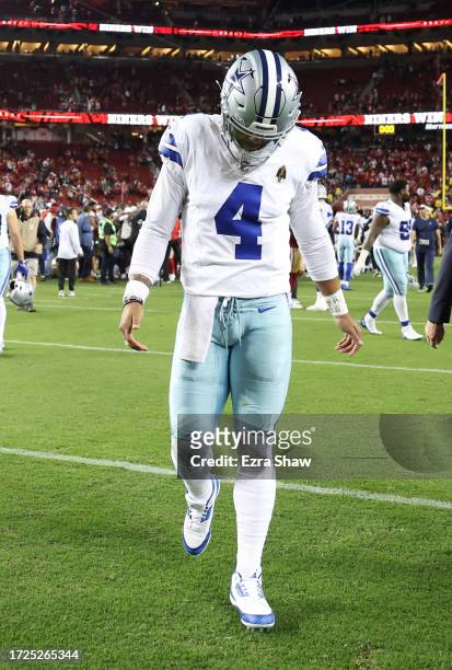 Dak Prescott of the Dallas Cowboys walks off the field after a 42-10 loss against the San Francisco 49ers at Levi's Stadium on October 08, 2023 in...