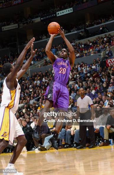 Rushing Raptos Alvin Williams of the Toronto Raptors puts a shot up over Kareem Rush ...