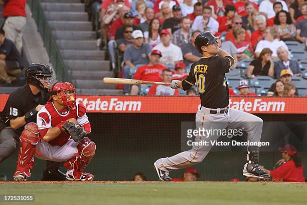 Jody Mercer of the Pittsburgh Pirates hits a two-run homerun to left field in the second inning during the MLB game against the Los Angeles Angels of...